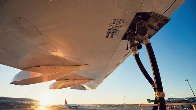 Aircraft ground-service hose connection under a passenger aircraft